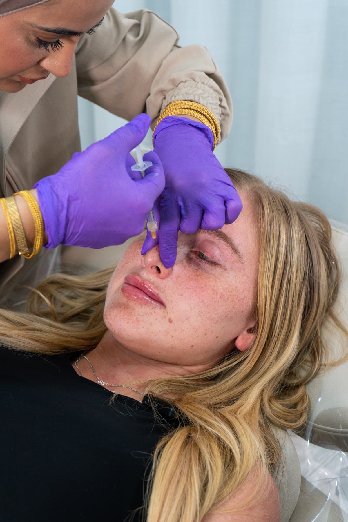 Nose filler treatment in progress at House of Riri