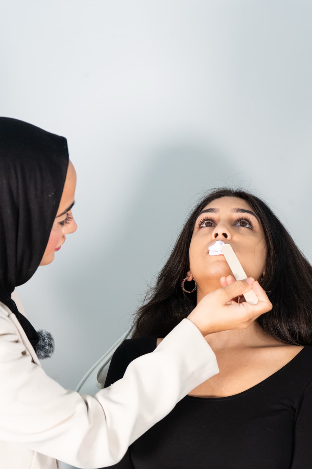 Lip filler treatment in progress at House of Riri