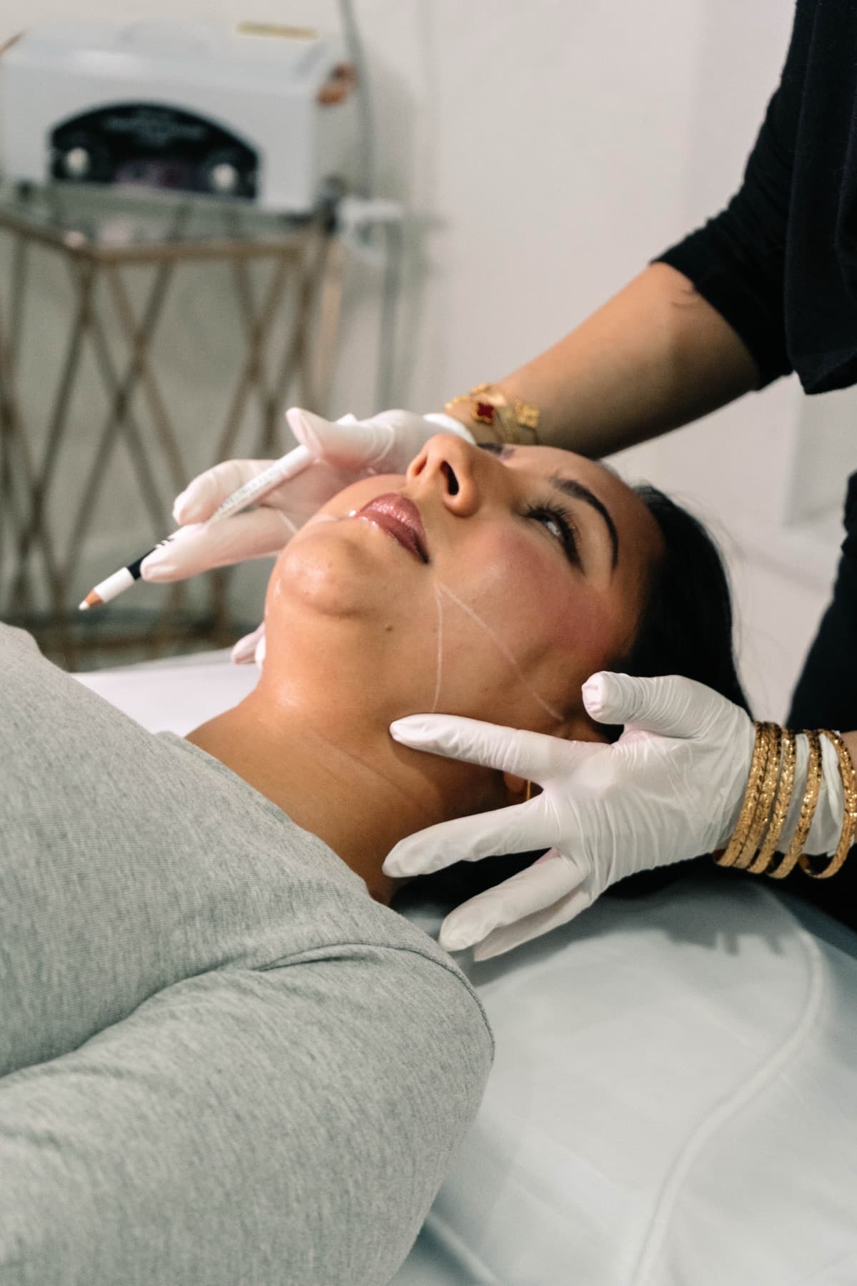 Jawline filler treatment in progress at House of Riri