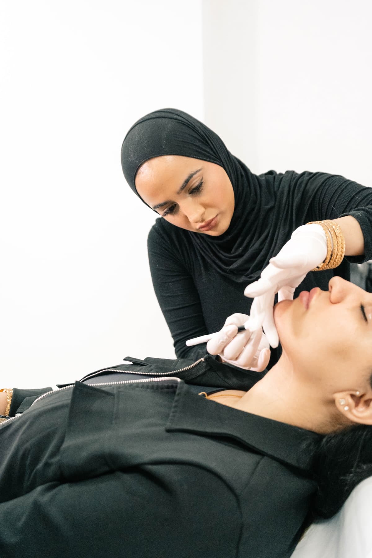 Practitioner administering Lemon Bottle fat dissolving injections