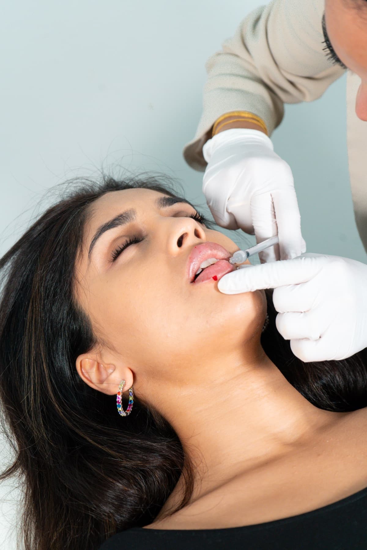 Lip filler being injected at House of Riri