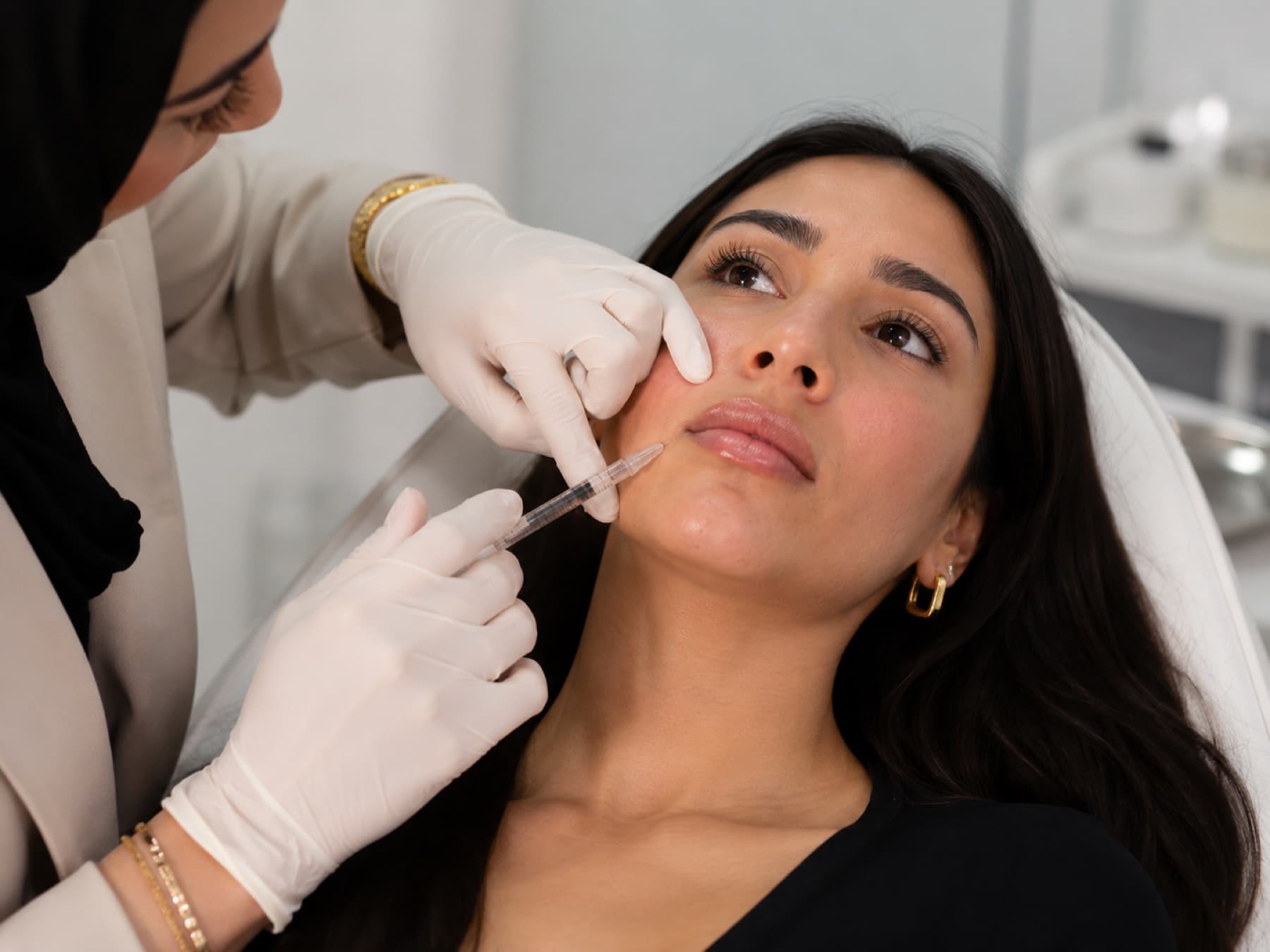 Practitioner administering nasolabial fold filler at House of Riri